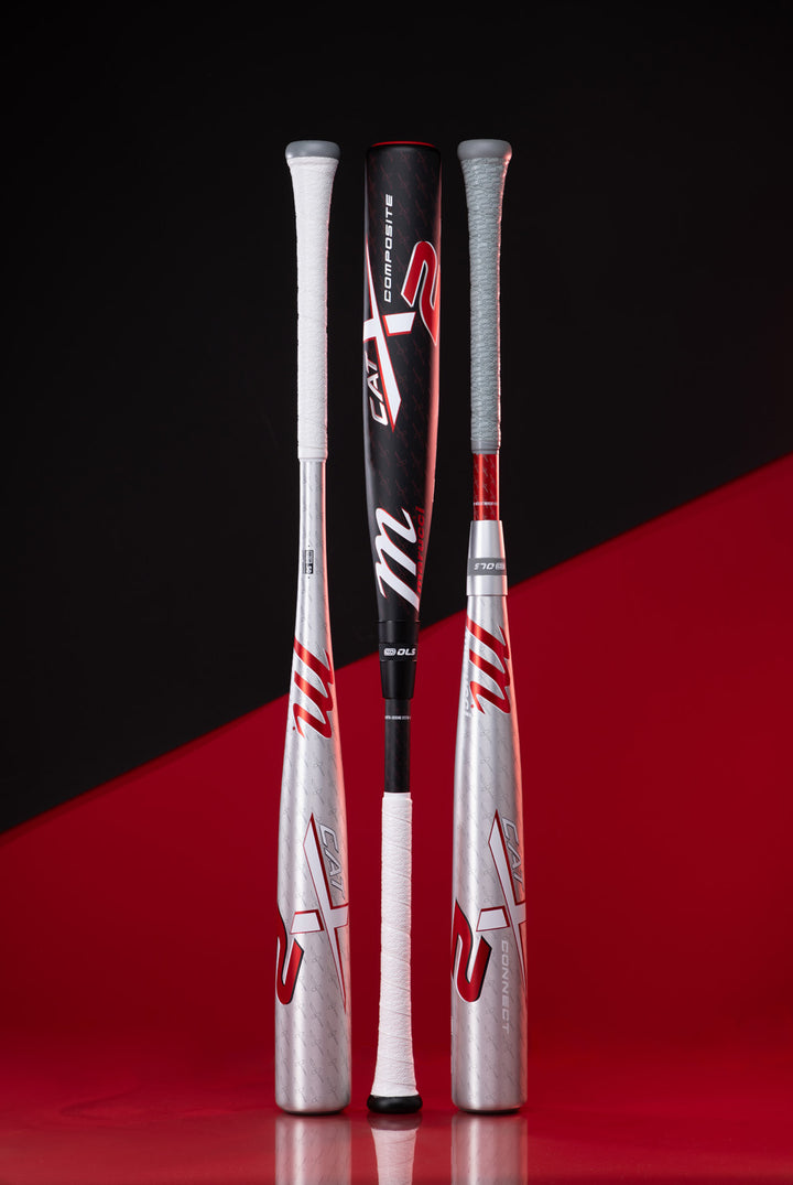 Three Marucci 2025 CATX2 Connect (-3) BBCOR bats stand upright against a split black and red background. The center bat features bold red and white accents, while the two on either side display sleek silver with red and white details.