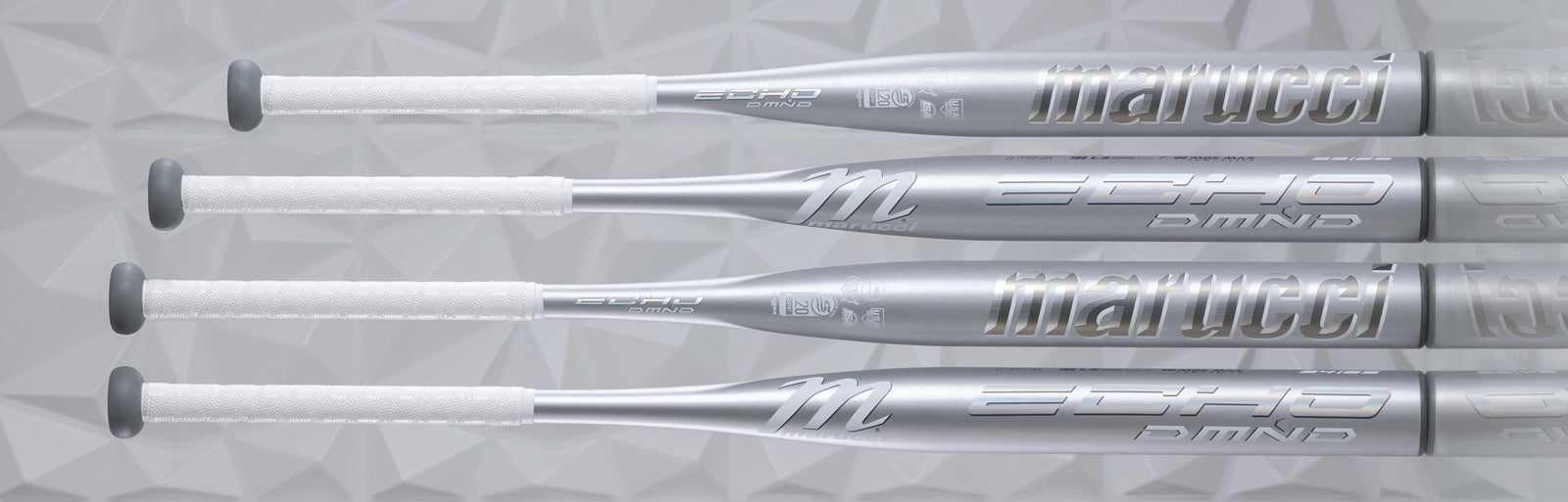 Four silver Marucci Echo DMND baseball bats with white grips are aligned horizontally against a textured, geometric gray background. The brand name and model details are visible on the bats.