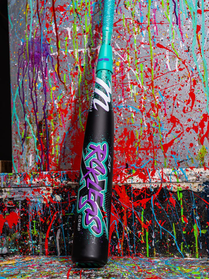 The 2026 Marucci CAT X RCKLESS Composite (-5) USSSA Baseball Bat features a composite barrel with vibrant, colorful paint accents.