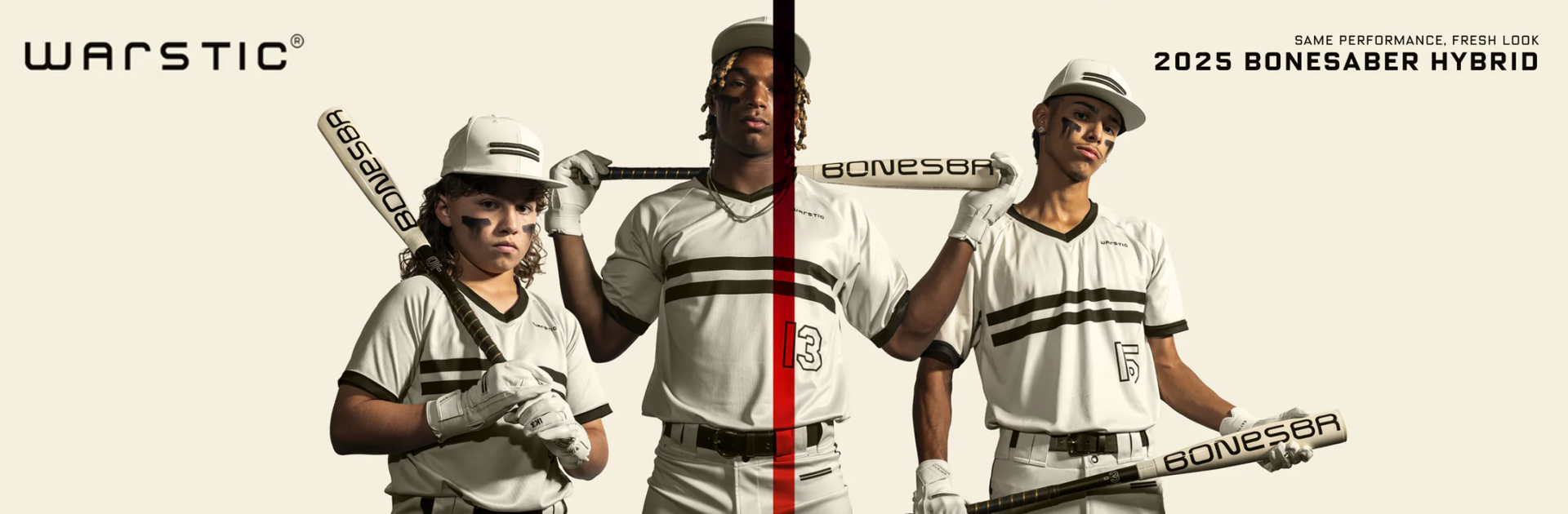 Three young baseball players wearing white uniforms and holding Warstic Bonesaber Hybrid bats pose confidently against a light background. The text reads: “2025 Bonesaber Hybrid” and “Same Performance. Fresh Look.”.