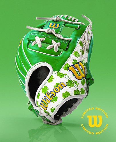 The Wilson A2000 1786 11.5" MDA Shamrocks Baseball Glove, featuring green and white Pro Stock leather with clover designs and yellow logos, is shown on a green background with a Limited Edition emblem in the corner.