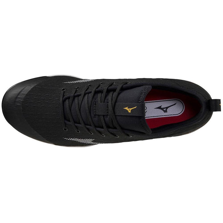 Top view of Mizuno Dominant 4 Men's Metal Baseball Cleats (320667), featuring black laces, a woven knit upper with textured toe, white side accents, and an insole with a gold and black Mizuno logo.