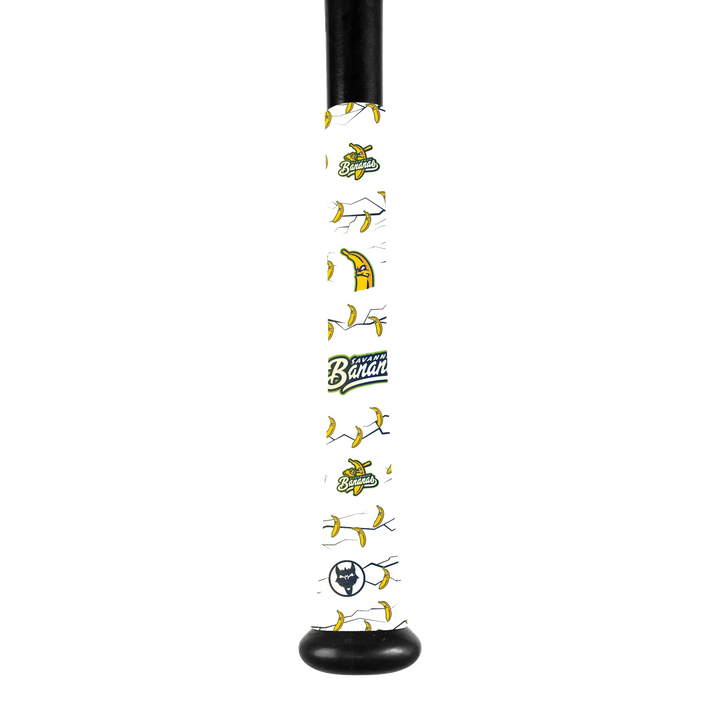 A close-up of a VukGripz Bat Grip Tape by VukGripz featuring cartoon bananas, a Banana Ball logo, and a small circular emblem at the end for optimum grip.