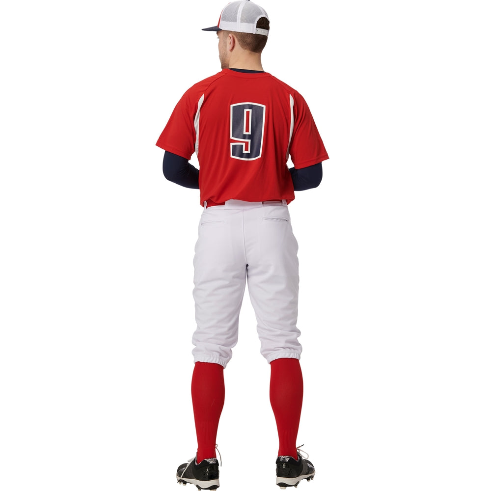 A baseball player stands facing away in a red jersey with the number 9, red socks, black cleats, a white and red cap, and Champro Sports Adult Triple Crown 2.0 Knicker Baseball Pants (BP68).