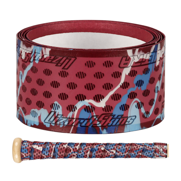 The Lizard Skins DSP Ultra Camo 1.1mm Bat Grip features a red, blue, and black abstract spotted design, shown both rolled up and wrapped around a wooden bat handle.