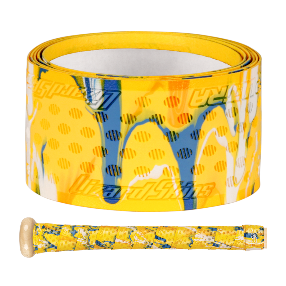 A roll of Lizard Skins DSP Ultra Camo 1.1mm Bat Grip in yellow with blue, white, and orange abstract patterns is shown next to a baseball bat handle wrapped with the same colorful grip by Lizard Skins.