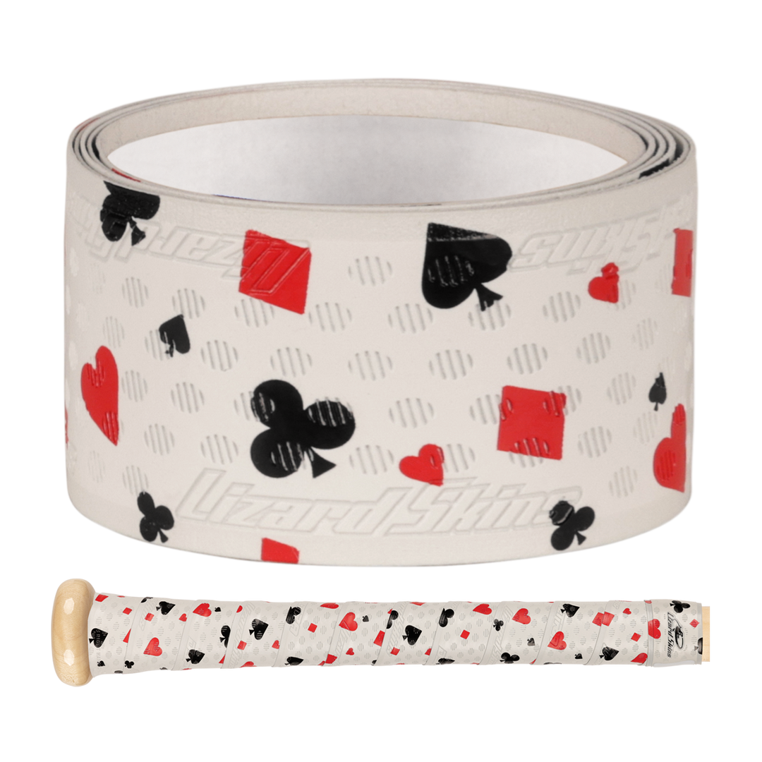 A Lizard Skins DSP Ultra Outburst 1.1mm Bat Grip in Hold’em White, featuring red and black playing card suits, is displayed beside a bike handle wrapped in the same durable polymer grip.