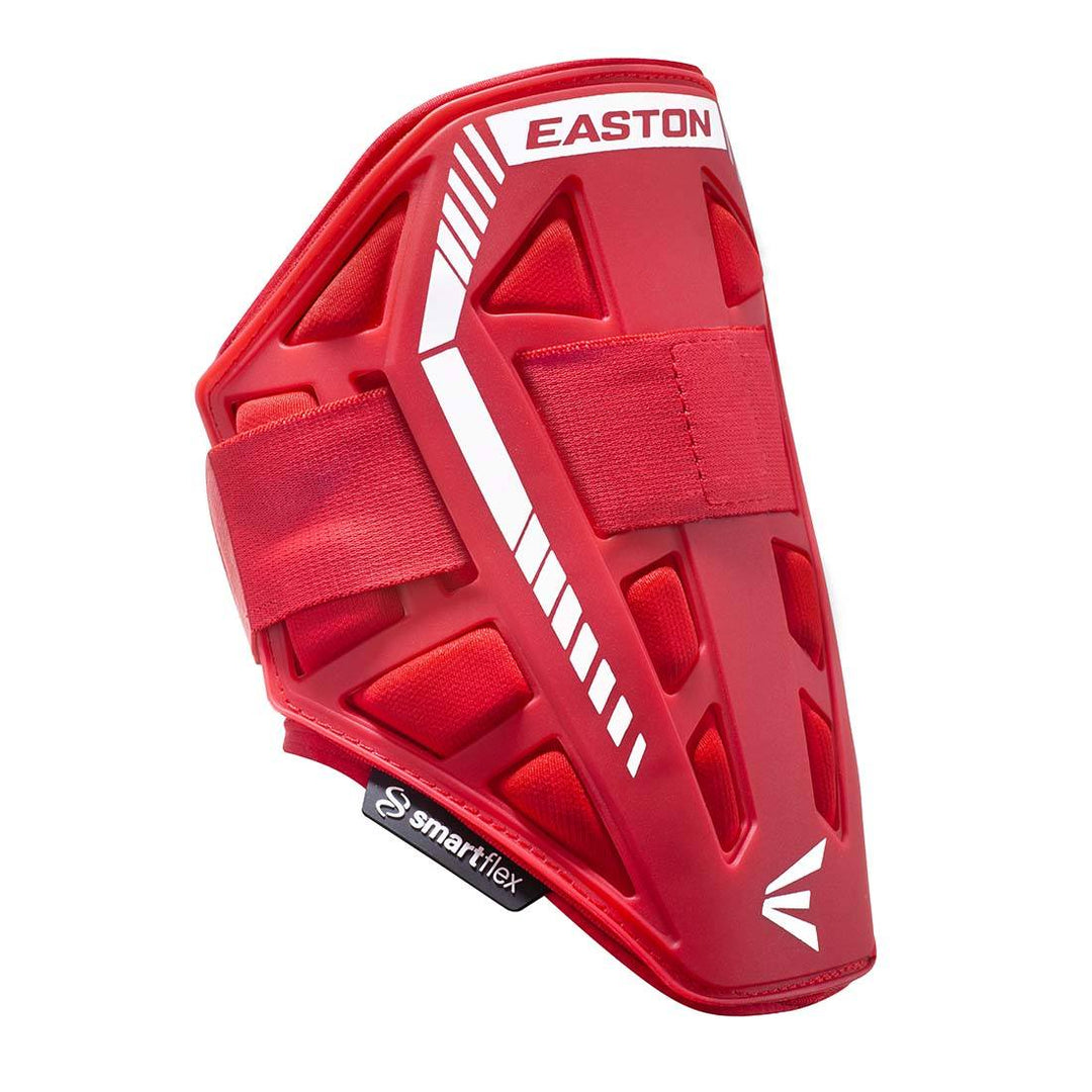 The red Easton Compact Batter Elbow Guard: ES37 features white accents, adjustable straps, and a vented geometric design for protection. Pair it with an Easton leg guard for full coverage. The smartflex logo appears on a black tag at the bottom.