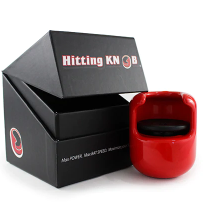 The Hitting Knob Bat Weight by Hitting Knob is a red baseball training aid positioned before a black box with sports-themed branding, designed to help players boost bat speed and performance.