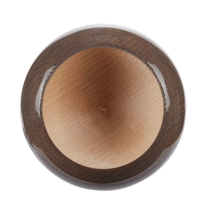A top-down view of a round wooden bowl with a smooth, light-colored interior reminiscent of the AXE Flared Pro Series Maple Wood Baseball Bat: L124K-FLR by AXE, and a dark, glossy exterior.