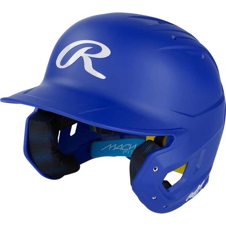 A blue Rawlings Mach Fit Matte Batting Helmet (MACHFIT) with a white R logo, black IMPAX foam padded interior, and dual ear protection, displayed on a plain white background.