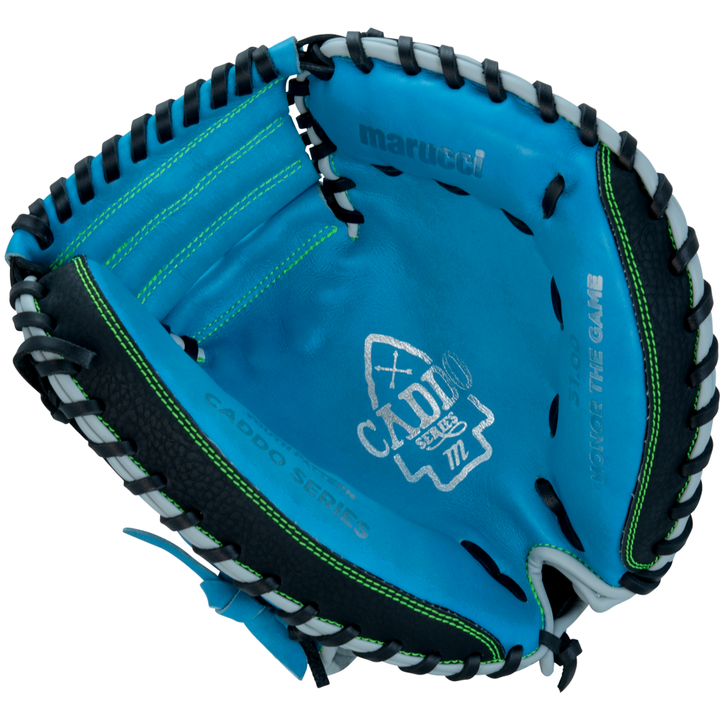 The Marucci Caddo 31" Baseball Catcher's Mitt (MFG3CD310-SB/BK) features a blue and black design with green stitching, “Caddo Series” and “Honor The Game” inside, and is crafted from full-grain cowhide leather for durability.