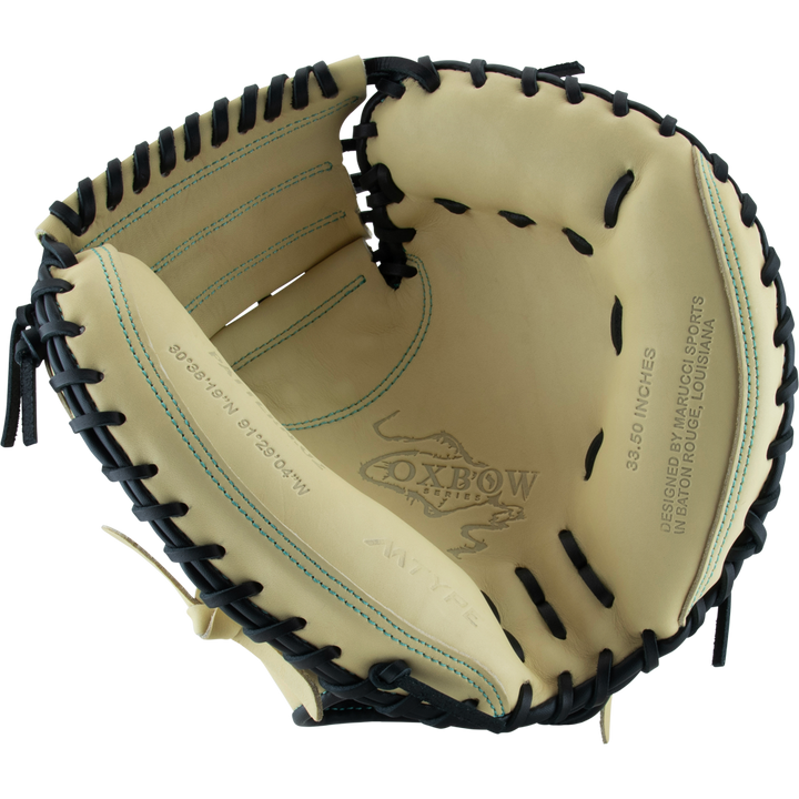 The Marucci Oxbow 235C1 33.5" Baseball Catcher's Mitt features tan and black full-grain cowhide leather, visible stitching, professional-grade rawhide laces, and "Oxbow" printed inside the palm.