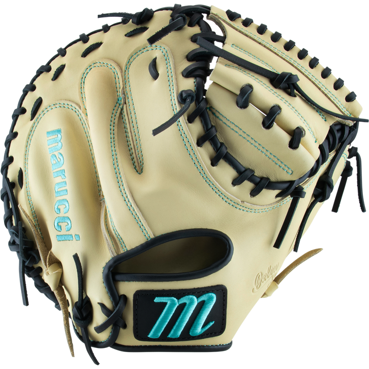 The Marucci Oxbow 235C1 33.5" Catcher's Mitt features tan full-grain cowhide leather, black laces, teal stitching, and a teal M logo on the wrist strap. The open mitt displays its inner palm and finger slots.