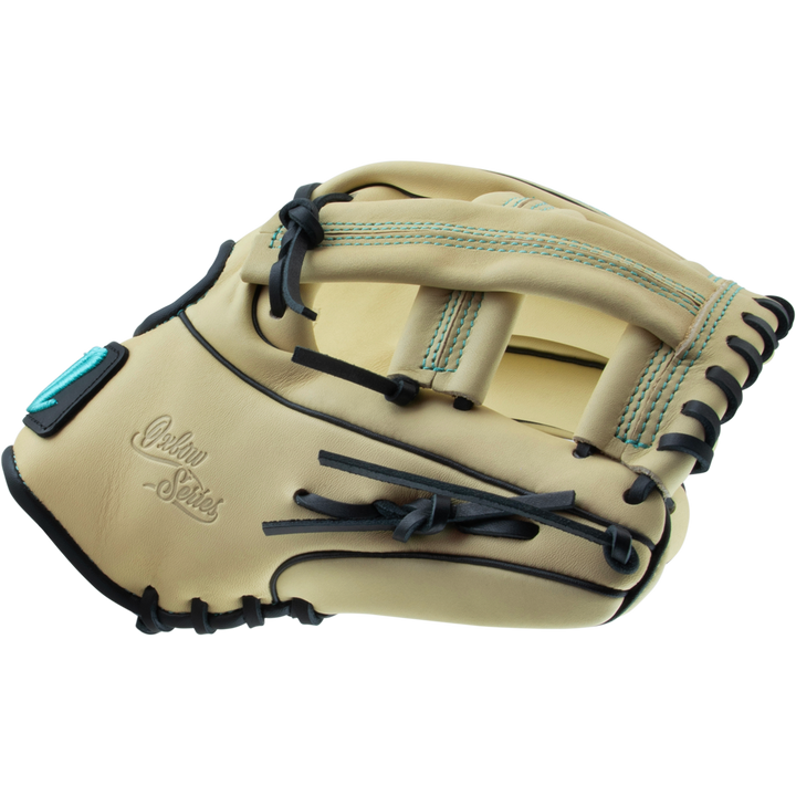 The Marucci Oxbow 44A4 11.75" Baseball Glove features tan full-grain cowhide leather, black laces, teal stitching accents, and the Marucci logo embossed on the palm.