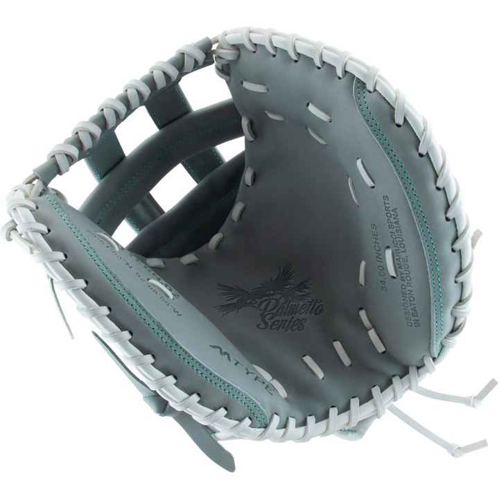 A close-up of an open Marucci Palmetto 240C2 34" Fastpitch Catcher's Mitt (MFG3PL240C2FP-GY) in gray steerhide leather with white laces, showing the palm area and printed text "Palmetto Series" and "34.0 inch" inside.