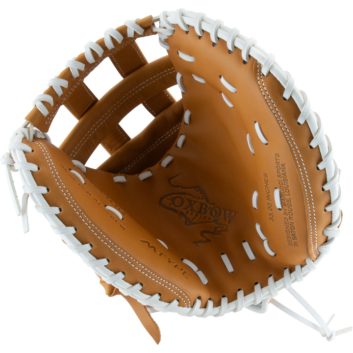 A tan Marucci Oxbow 240C2FP 33" fastpitch catcher's mitt, made of full-grain cowhide leather with white laces, is open and viewed from above, displaying the Marucci logo and text stamped inside the glove.