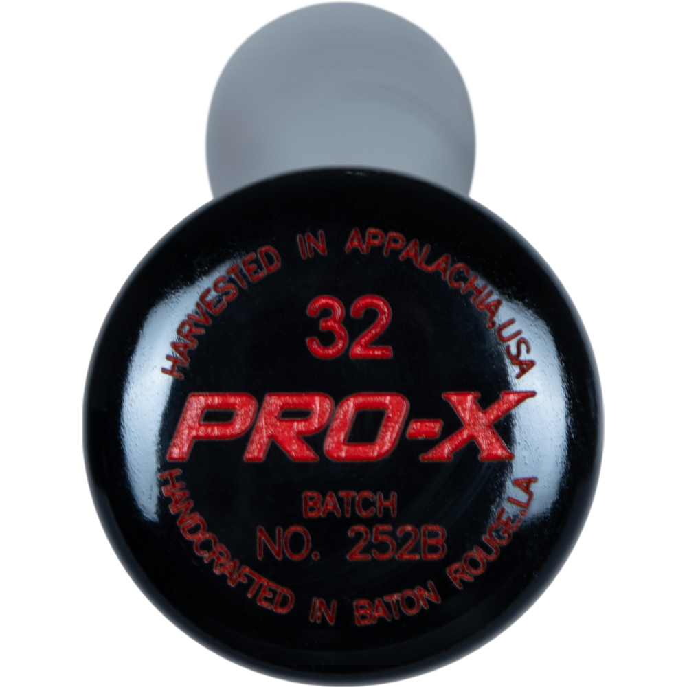 A close-up of a black Marucci TVT Trea Turner Pro Exclusive Maple Wood Bat (MVE4TVT-BK/BOR), modeled after Trea Turner's bat.