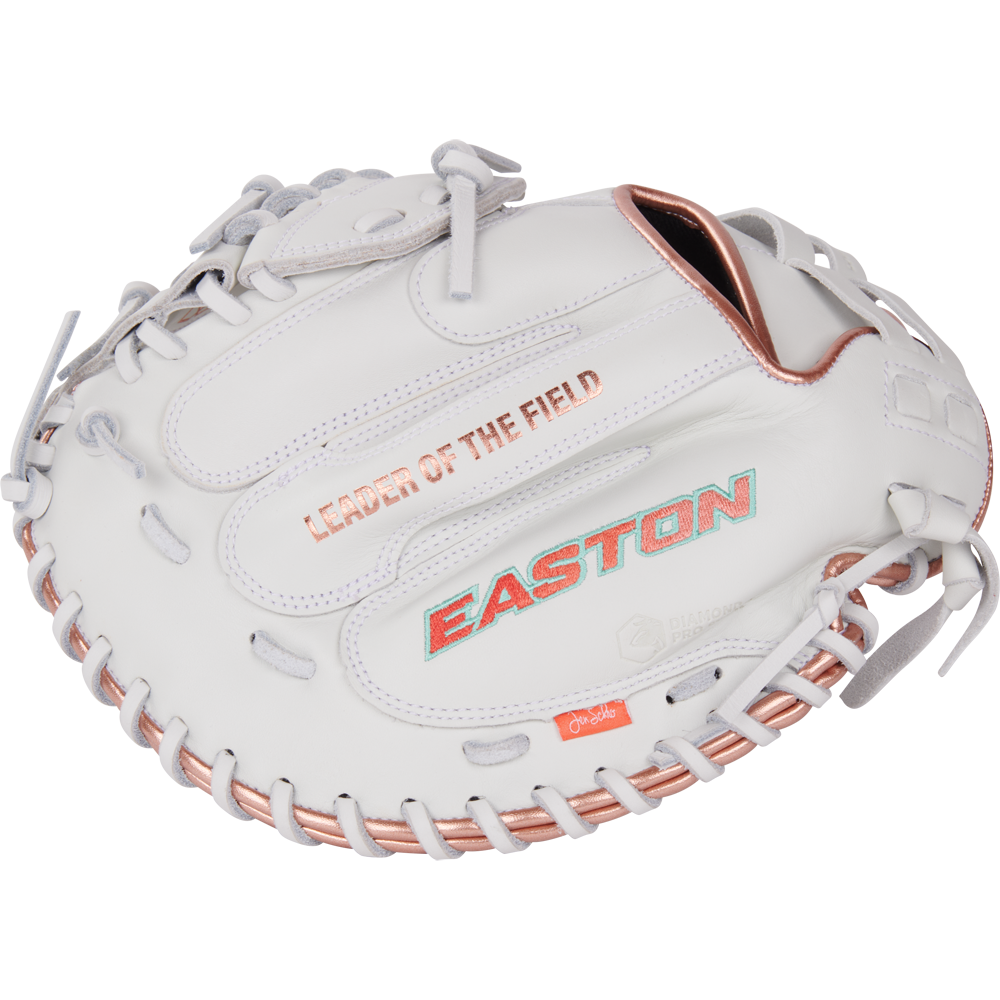 The Easton Jen Schro MYWHY 33" Fastpitch Catcher's Mitt (MYWHY-THENONO) features white and rose gold colors, LEADER OF THE FIELD and EASTON printed on it, detailed stitching, and premium Diamond Pro steerhide leather.