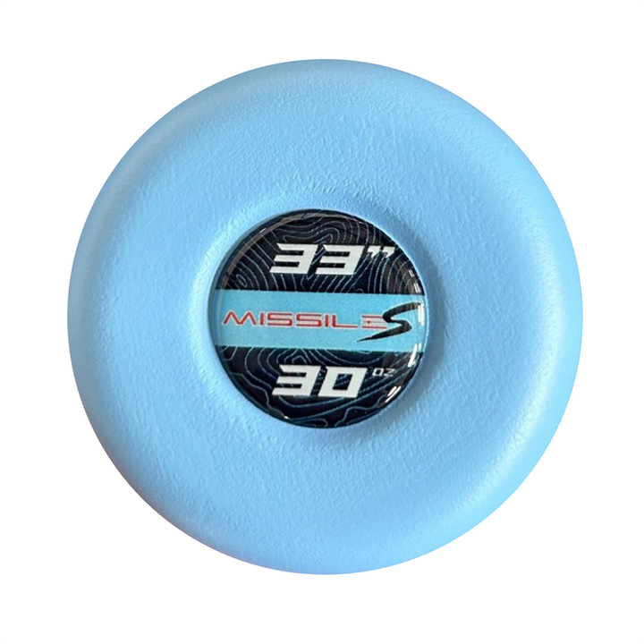 A light blue round disc features a central black label with "331," "MISSILES," "30 OZ," and a stylized S. The subtle wavy line pattern is inspired by the balanced swing weight of the 2024 Stinger Missile S (-3) BBCOR Baseball Bat from Stinger Sports.