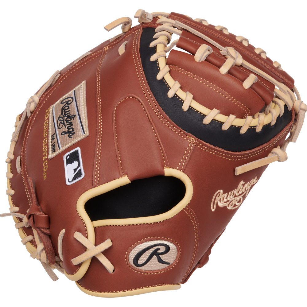 The Rawlings NXT 32.5" Baseball Catcher's Mitt (NXTCM325UDB) features brown leather, tan laces, the Rawlings logo, and a ContoUR fit design, displayed against a white background.
