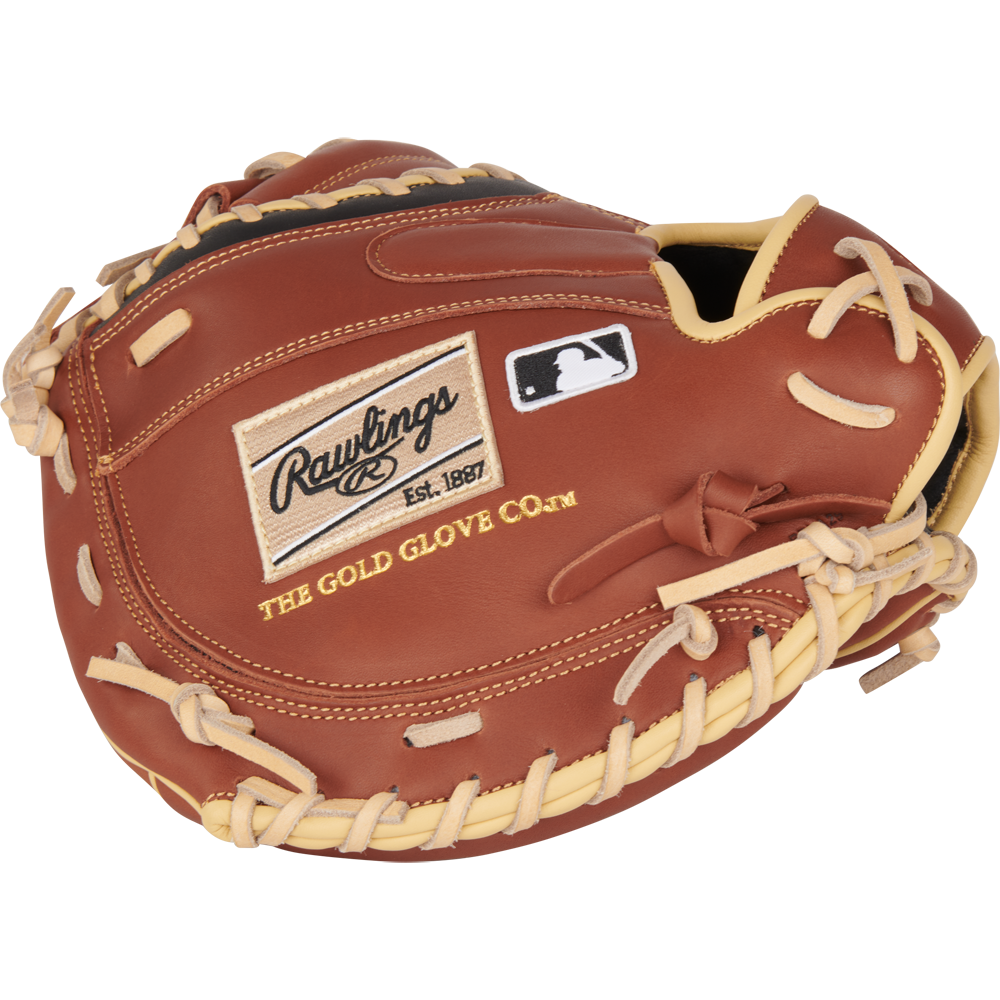 A Rawlings NXT 32.5" brown catcher's mitt (NXTCM325UDB) with ContoUR fit and tan laces, featuring the Rawlings logo, "Est. 1887", "The Gold Glove Co." text, and a small MLB logo patch.