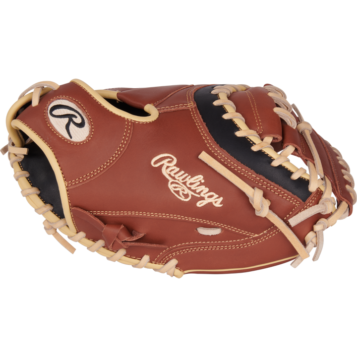 The Rawlings NXT 32.5" Baseball Catcher's Mitt (NXTCM325UDB) features a brown and black design with tan laces, ContoUR fit for comfort, and the stitched Rawlings logo.