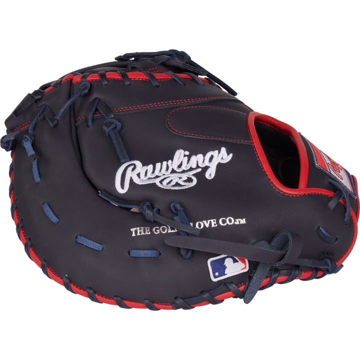 The Rawlings NXT 12.25" Baseball First Base Mitt (NXTDCTU-10N) features dark blue leather with red stitching, Rawlings branding, and an MLB patch—perfect for serious players seeking a top-tier travel ball glove.