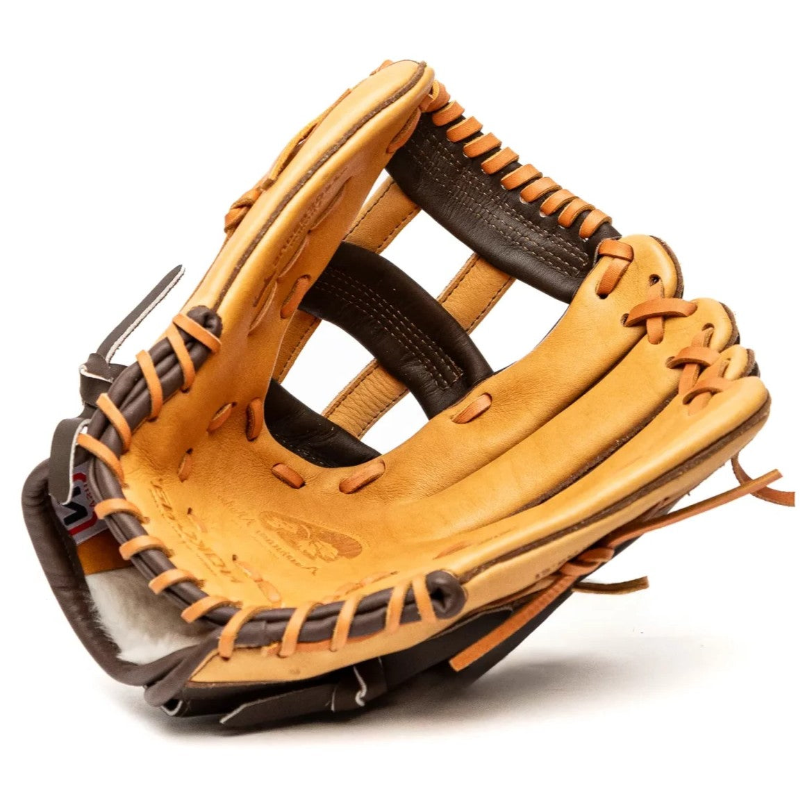 The Nokona Alpha 12.5" Fastpitch Glove: S-V1250H features a tan and brown design with black laces, shown open to display its inside pocket and webbing—crafted American-made quality from Nokona.