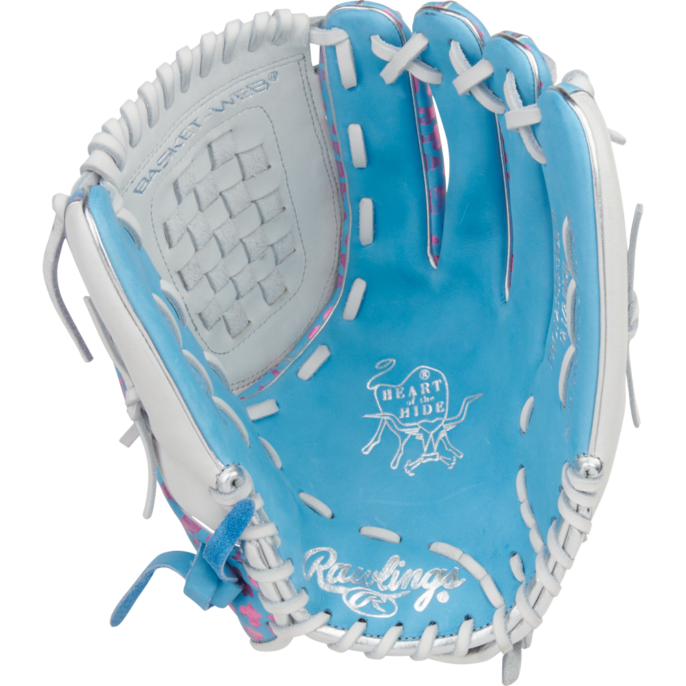 The Rawlings Heart of the Hide 12.5" Fastpitch Glove (PRO125SB-3CBW) features a blue and white design with white laces, pink accents, a basket web, and the iconic Heart of the Hide logo.
