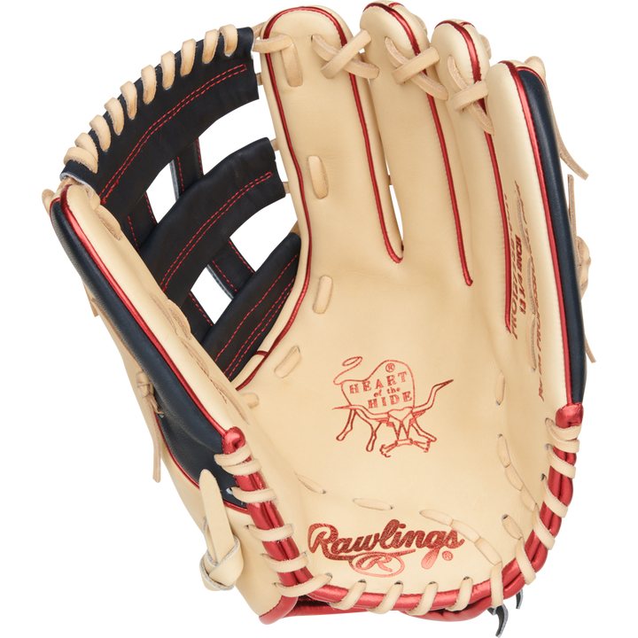 The Rawlings Heart of the Hide 12.75" Fastpitch Glove (PRO1275SB-6CN) is a tan glove with red and black accents, visible stitching on the palm and webbing, and features iconic Heart of the Hide branding.