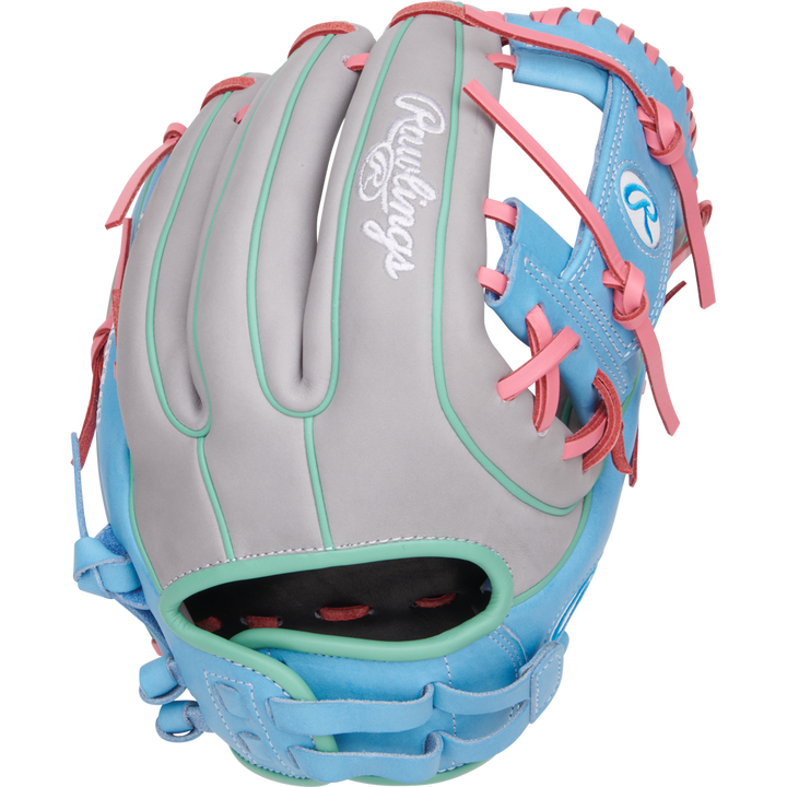 The Rawlings Heart of the Hide 12" Fastpitch Glove (PRO716SB-2GCB) features gray, blue, and teal leather with pink laces and accents. The Rawlings logo appears on the back and thumb—ideal for fastpitch softball.