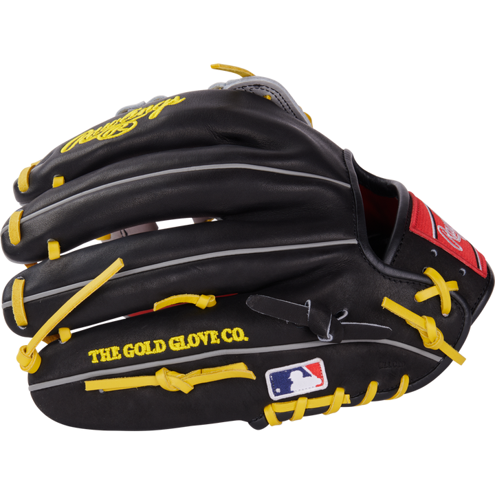 The Rawlings Heart of the Hide 12.25" Baseball Glove (PROKB17SB) is black with yellow laces, “THE GOLD GLOVE CO.” text, MLB logo on the thumb, white and gray accents, and a red Rawlings patch near the wrist.