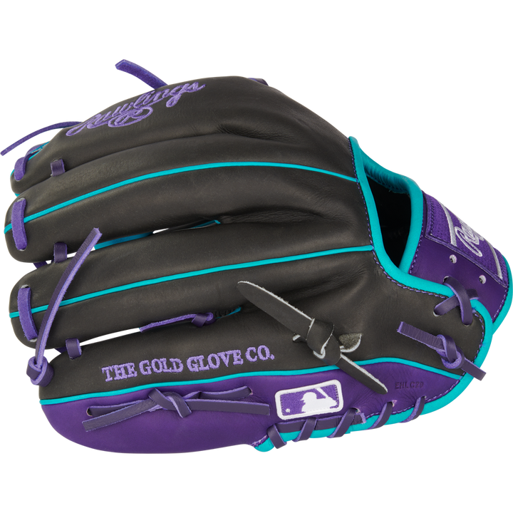The Rawlings Heart of the Hide 11.5" Baseball Glove (PROR204-2DSTP) is black with purple laces, teal accents, a stitched purple Rawlings logo, and features THE GOLD GLOVE CO. and MLB logos on the thumb area.