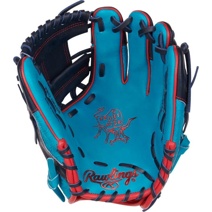 The Rawlings Heart of the Hide 11.5" Color Sync Baseball Glove (PROR204-2TE) features turquoise and navy leather, red stitching, black laces, and the iconic Heart of the Hide logo embossed on the palm—an exclusive from Rawlings.