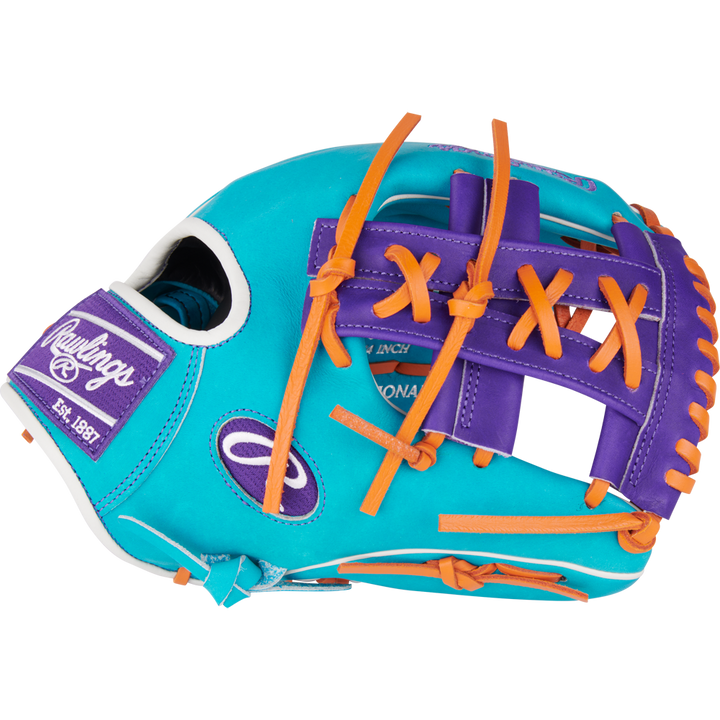 The Rawlings Heart of the Hide 11.75" Baseball Glove (PROR205-32TEP) features bright turquoise leather, orange laces, purple accents, white stitching, and a Rawlings Est. 1887 patch on the side.