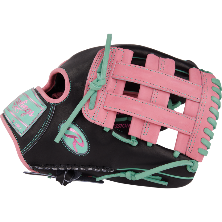 The Rawlings Heart of the Hide 12.25" Color Sync Baseball Glove (PROR207-6BP) features a black design with pink and teal laces, stitching, and accents, plus a pink patch, teal webbing highlights, and bold branding details.