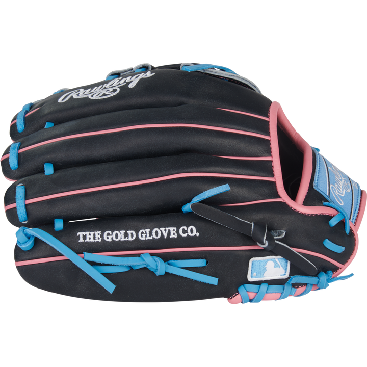 The Rawlings Heart of the Hide 12.5" Baseball Glove (PROR3028U-6N) features black leather with pink and blue laces, THE GOLD GLOVE CO. and MLB logos on the side, and the Rawlings logo on the wrist strap for standout style.