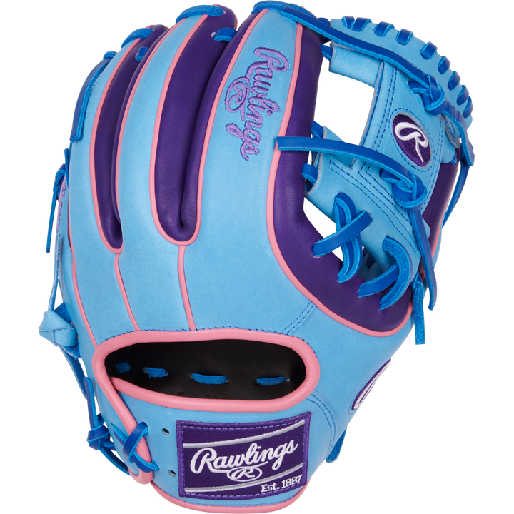 The Rawlings Heart of the Hide 11.5" Color Sync Baseball Glove (PROR314-2CBPU) features blue, purple, and pink colors with bright blue laces and the Rawlings logo on the wrist patch and thumb.