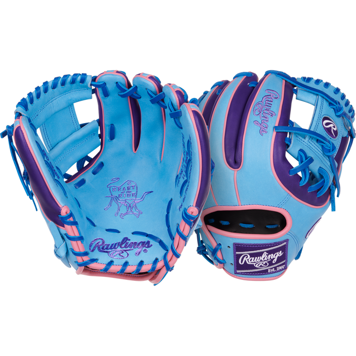 Two blue Rawlings Heart of the Hide 11.5" Color Sync gloves (PROR314-2CBPU) with pink and purple accents are displayed, showing both palm and back, with playful graphics and the Rawlings logo on palm and wrist.