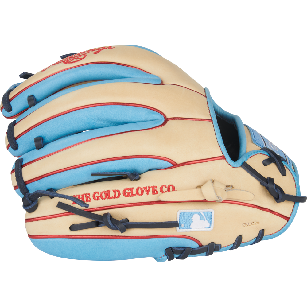 The Rawlings Heart of the Hide 11.5" Baseball Glove (PROR314-2CCB) features a tan and light blue design, red stitching, blue laces, "THE GOLD GLOVE CO." embroidery, and an MLB logo patch near the wrist opening.