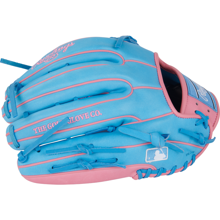 The Rawlings Heart of the Hide 12.75" Baseball Glove (PROR3319-4CB) features bright blue leather, pink accents and stitching, a logo patch, THE GOLD GLOVE CO. text, and a white MLB silhouette on the side.