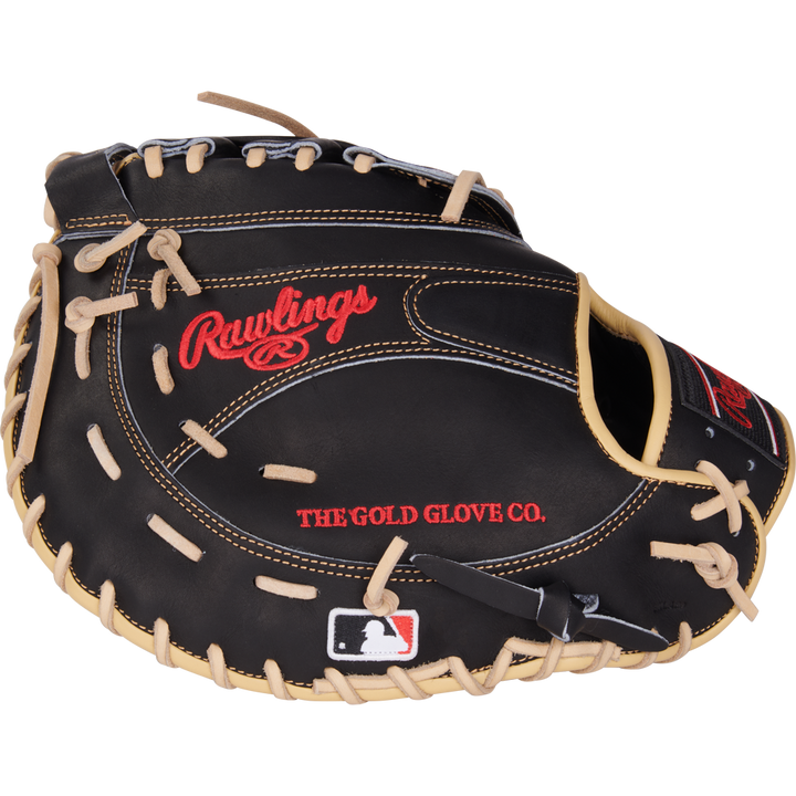 A black Rawlings Heart of the Hide 12.5" first base mitt (PRORFM18-17BCS) features tan laces, red embroidered Rawlings and THE GOLD GLOVE CO. text, and an MLB logo patch on the wrist area.
