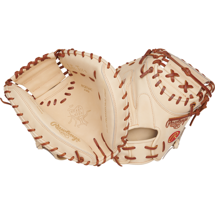 The Rawlings Heart of the Hide 34" Yadier Molina Catcher's Mitt (PRORYM4C) is shown open, highlighting its tan and brown premium leather, detailed lacing, intricate stitching, and embossed branding.
