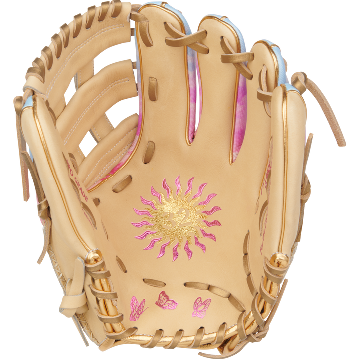 The Rawlings Heart of the Hide 12" Sierra Romero Game Model Fastpitch Glove (PROSR32C) features tan leather, gold and pink sun and butterfly palm designs, light brown laces, and pink inner accents—perfect for infielders.