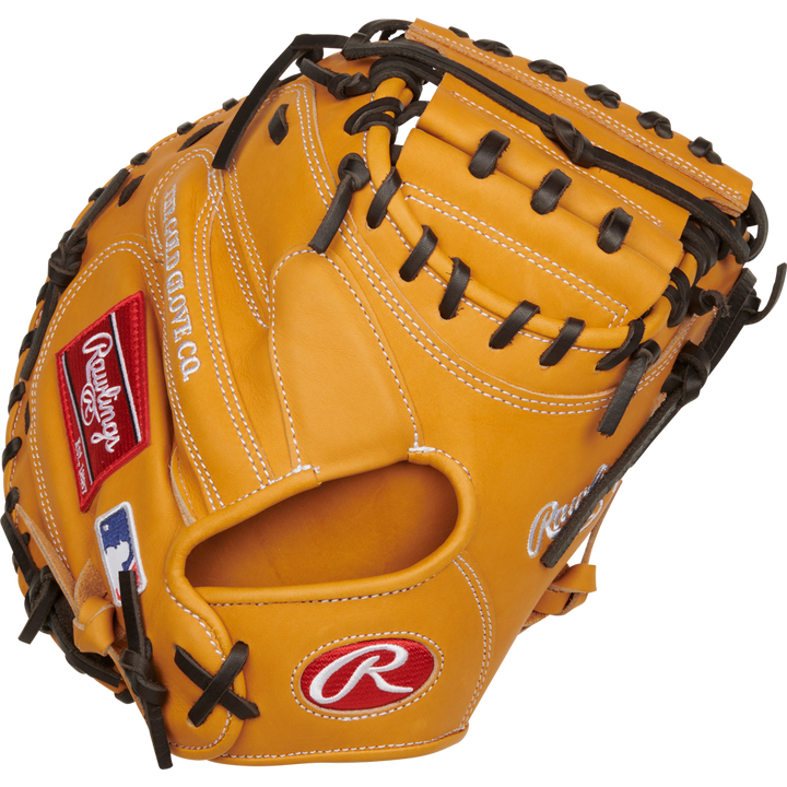 The Rawlings Heart of the Hide 33" Catcher's Mitt (RPROTCM33T) features a tan design with black laces, red and white Rawlings logos, and a white-stitched MLB logo on the wrist.
