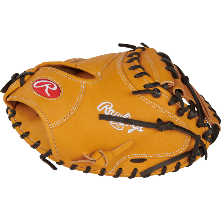 A tan Rawlings Heart of the Hide 33" catcher's mitt (RPROTCM33T) features black laces and white/red embroidered logos.