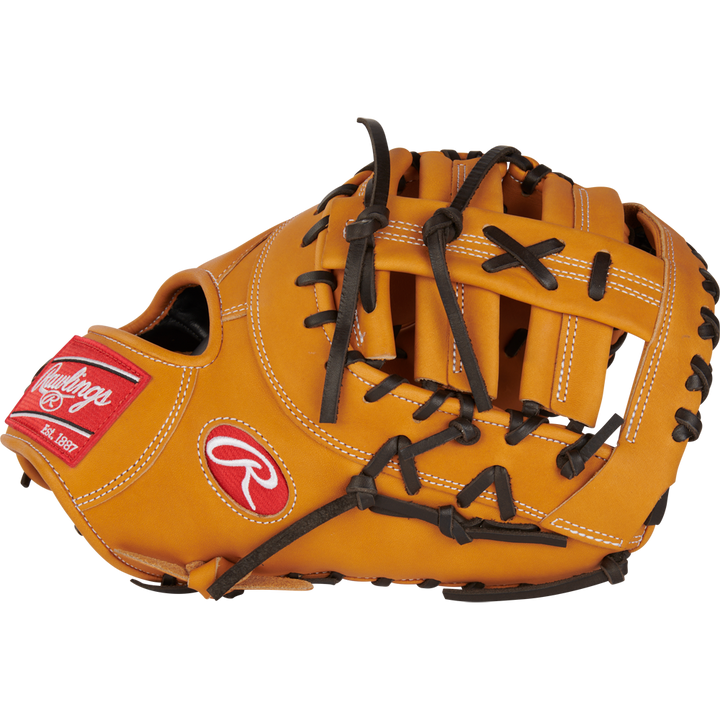 The Rawlings Heart of the Hide 13" First Base Mitt (RPROTDCTT) features tan leather, black laces, white stitching, and a red Rawlings logo patch on the wrist, displayed against a white background.
