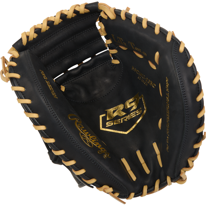 The Rawlings R9 32" ContoUR Baseball Catcher's Mitt (R9CMU-23BC) features a black design with tan lacing and a gold RG Series logo on the palm, showcasing detailed interior stitching in an open youth catcher's mitt.