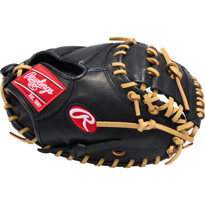 The Rawlings R9 32" ContoUR Baseball Catcher's Mitt (R9CMU-23BC) features a black design with tan laces and red Rawlings logos, shown on a plain white background—ideal for youth players seeking quality and comfort.